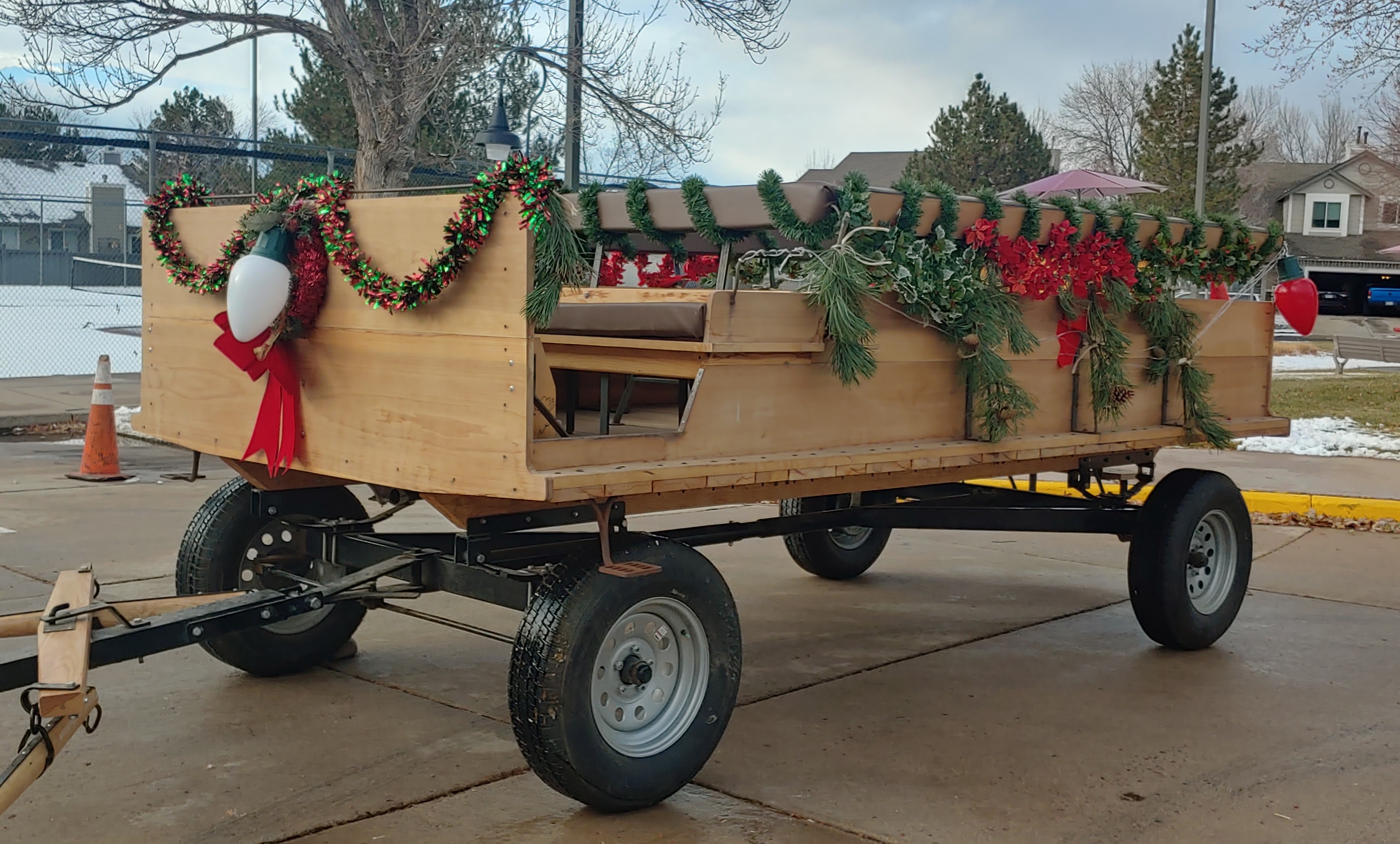 Holiday decorated trailer with wreaths and garland